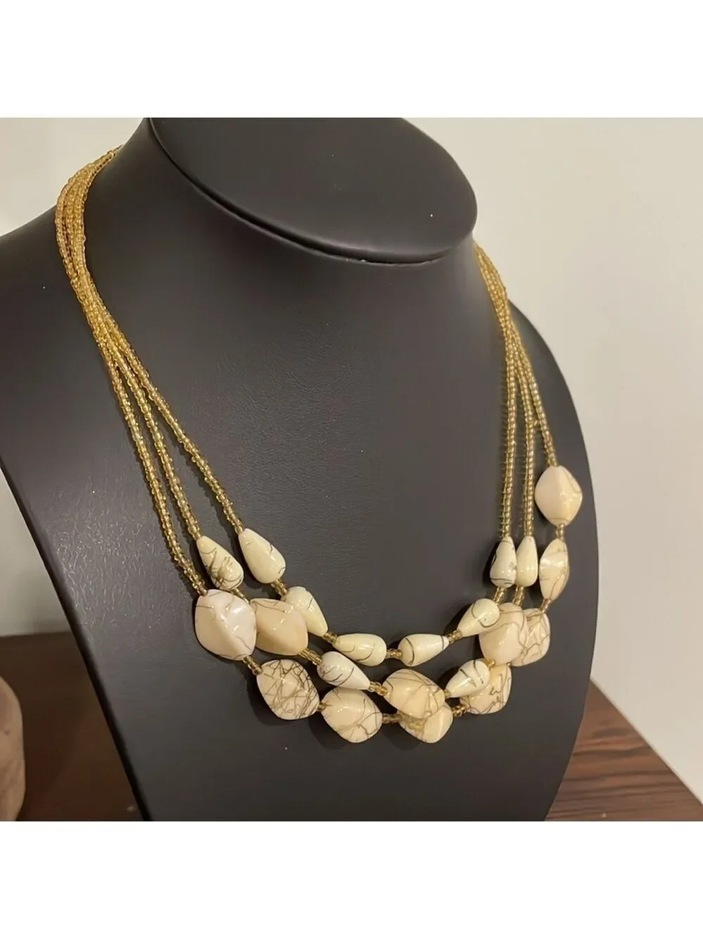 Vintage triple strand gold seed bead and ivory swirl beaded necklace